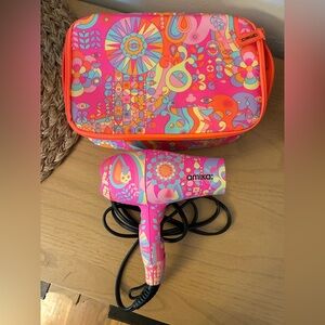 Like new! Amika colorful pink mini hair dryer with matching case.